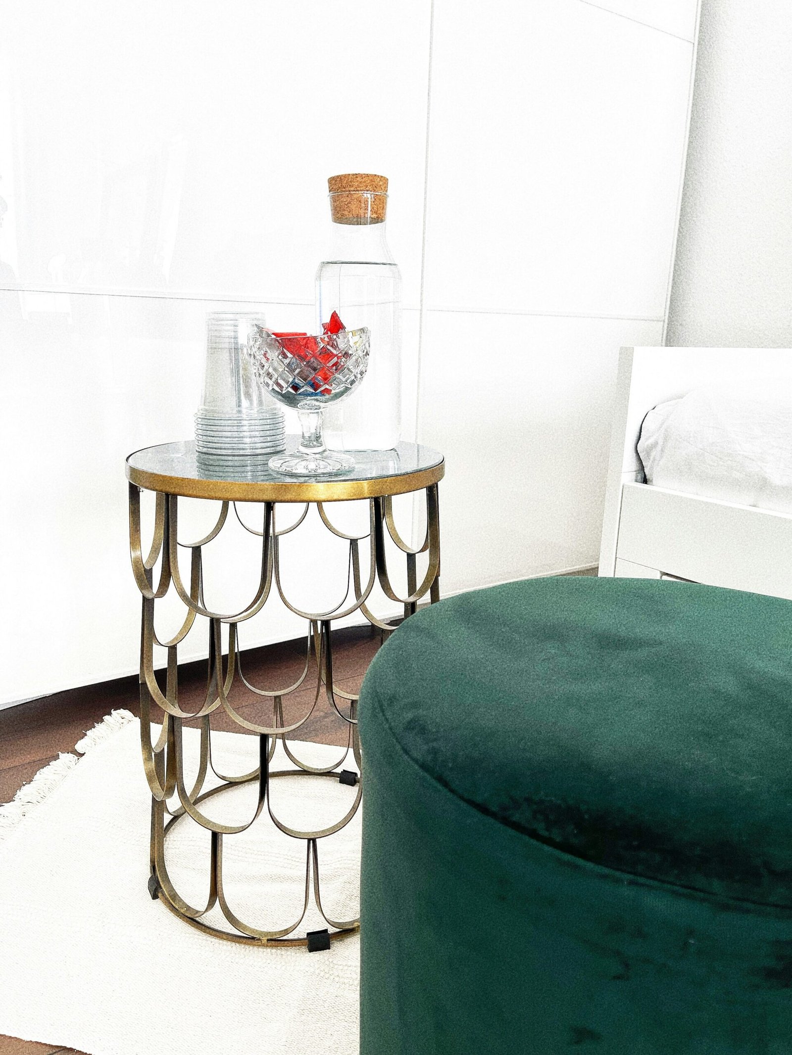 a table with a vase and a chair in a room
